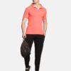 Men's coral polo T-shirt paired with black joggers and sneakers, styled for casual and active wear